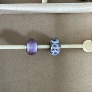 Marano, glass, flower bead and a cut glass bead that is similar to Alexandrite.